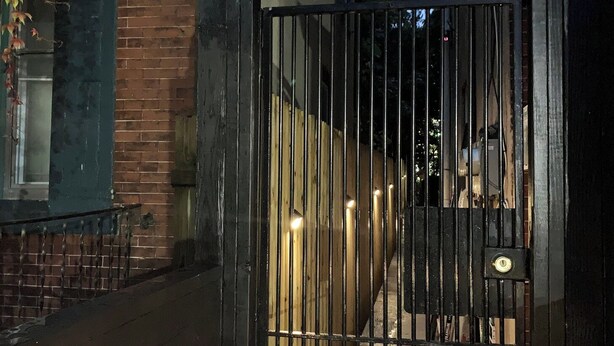 A gated entrance with a metal gate and a small window above it. - UInn-At UPenn; 1C- with a private courtyard and separate entrance. (Philadelphia)