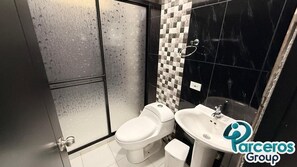 Shower, towels, soap, toilet paper