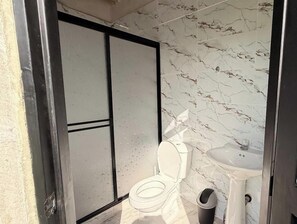 Shower, towels, soap, toilet paper