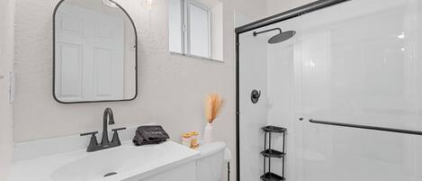 Shower, hair dryer, towels, soap