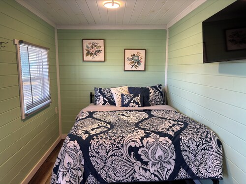 This unique tiny home has its own private pickleball court!