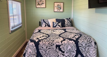 This unique tiny home has its own private pickleball court!