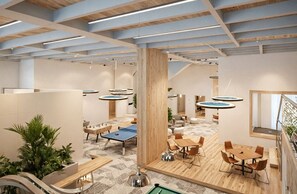 A modern indoor space with wooden floors, round tables, and a ping pong table. - Apartamentos Reserva del Mar II-by SOHO (Santa Marta)