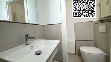 Shower, hair dryer, toilet paper