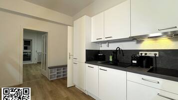 Fridge, stovetop, dishwasher, coffee/tea maker