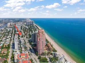 An aerial view of a coastal city with a prominent high-rise hotel adjacent to a beach. - 2301/U4-BeachFront-TreeHouse-Sensation-Apt-with AC-Downtown (Fort Lauderdale)