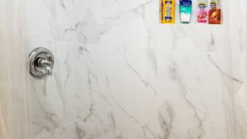 Shower, hair dryer, towels, soap