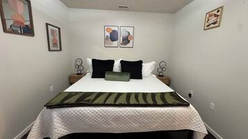 1 bedroom, desk, iron/ironing board, travel crib