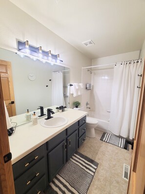 Jetted bath, hair dryer, towels, soap
