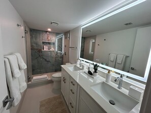 Shower, hair dryer, towels, soap