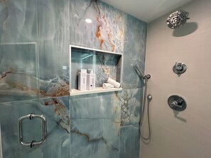 Shower, hair dryer, towels, soap