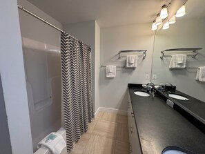 Shower, jetted bath, hair dryer, towels