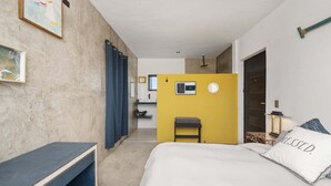 A hotel room with a bed, a desk, a chair, a small table, a mirror, a window, and a door. - Amazing Sea & Mountains Views
3 bed 4n half bathroom
Private 7m by 3mChukum pool (San Jose del cabo)