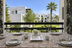 Outdoor dining - Spacious 4-bedroom apartment in Golf Cabo Negro with AC (Cabo Negro)