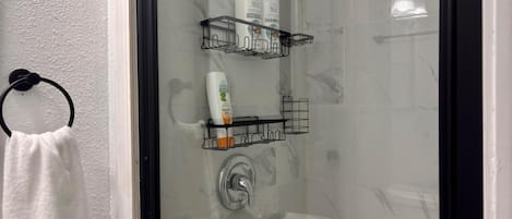 Shower, hair dryer, towels, soap