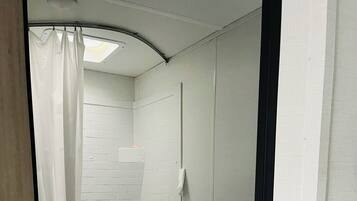 Shower, towels, soap, shampoo