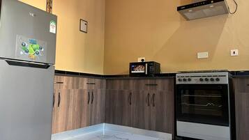 Fridge, microwave, cookware/dishes/utensils, paper towels