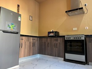 Fridge, microwave, cookware/dishes/utensils, paper towels - The Island at BofA Spacious 1BR Kilifi Villa • Pool • Fast Wi-Fi • AC • New  (Kilifi)