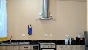 Fridge, microwave, cookware/dishes/utensils, paper towels