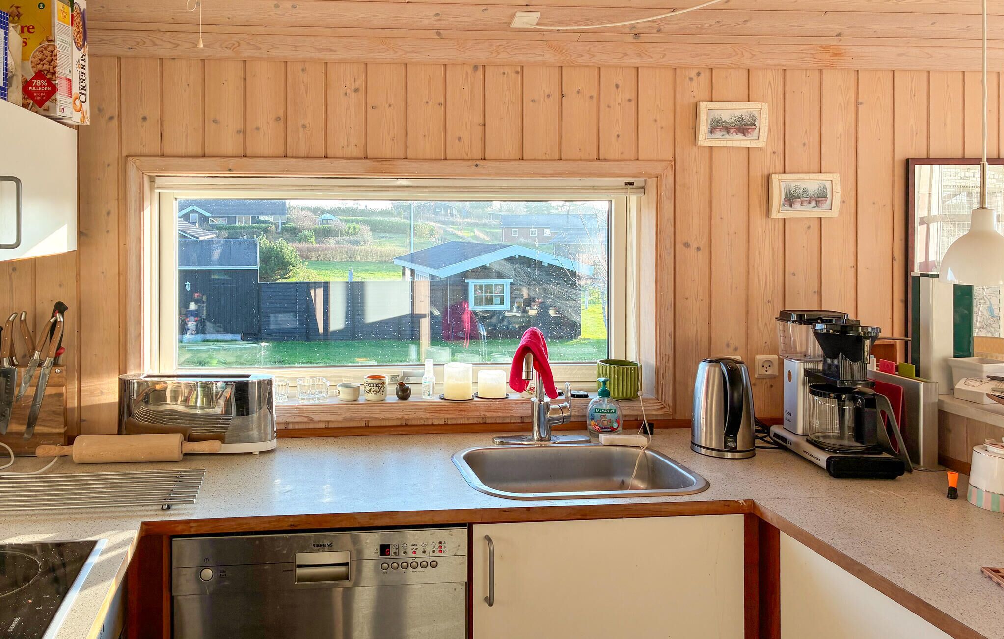 Fridge, stovetop, dishwasher, coffee/tea maker