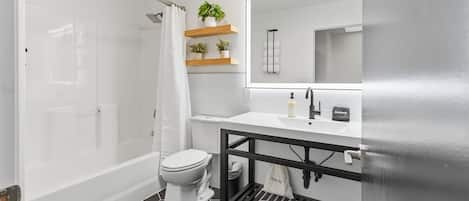 Shower, hair dryer, towels, shampoo