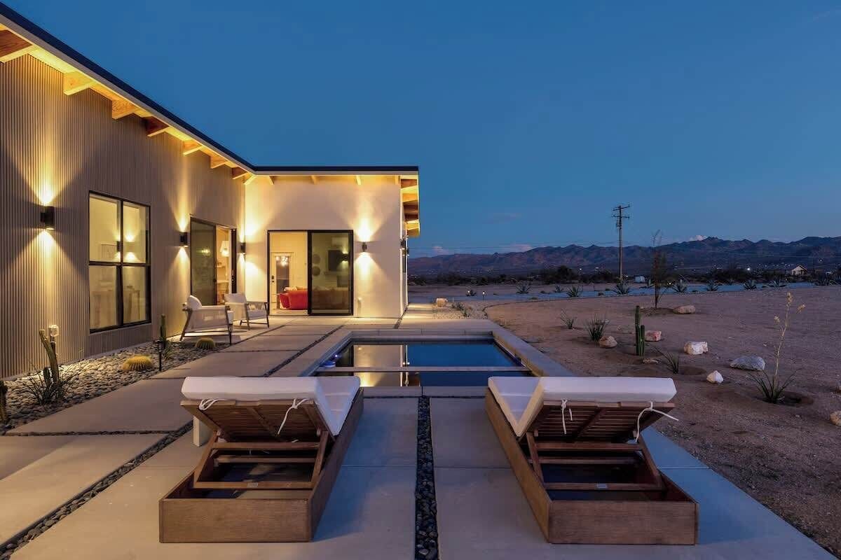 Pool deck and loungers at blue hour