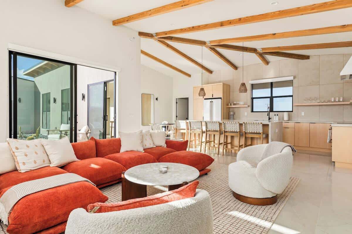 Living room seating beneath wood beams