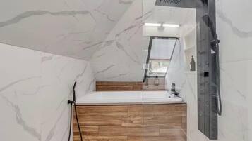 Shower, jetted tub, hair dryer, towels