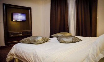 Standard Double or Twin Room | Minibar, in-room safe, desk, laptop workspace