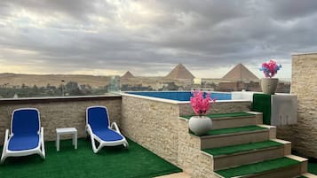 Outdoor pool, free cabanas, pool umbrellas