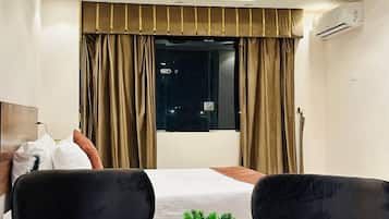 Deluxe eenpersoonskamer | Lakens van Egyptisch katoen, luxe beddengoed, donsdekens