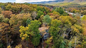 A house surrounded by dense forest with autumn foliage. - Mountain Retreat Near Bryce Resort. Game Rm. Sleeps 8 Family and Dog Friendly! (Basye)