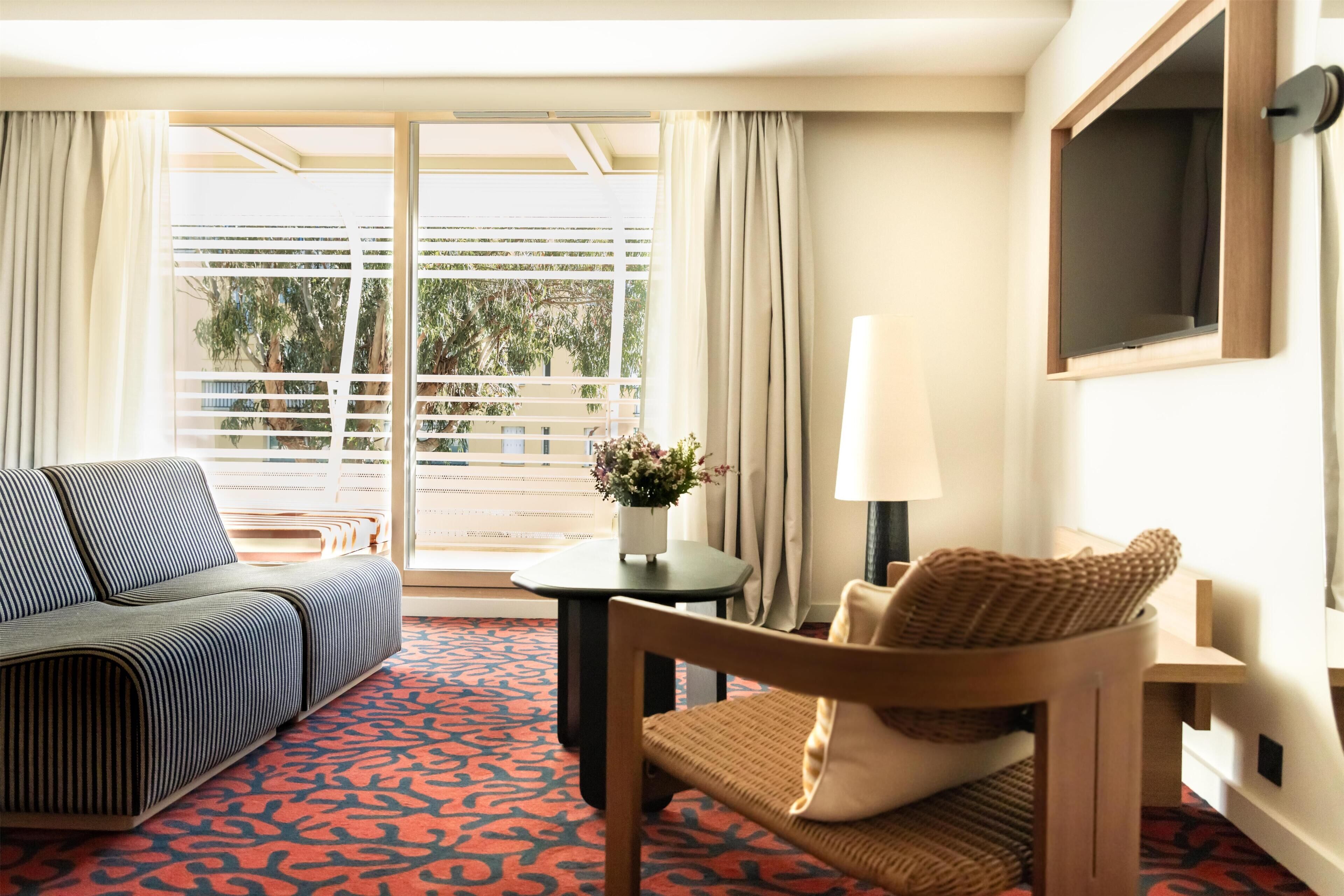 Deluxe Room, 1 King Bed | Living area | 55-inch flat-screen TV with digital channels