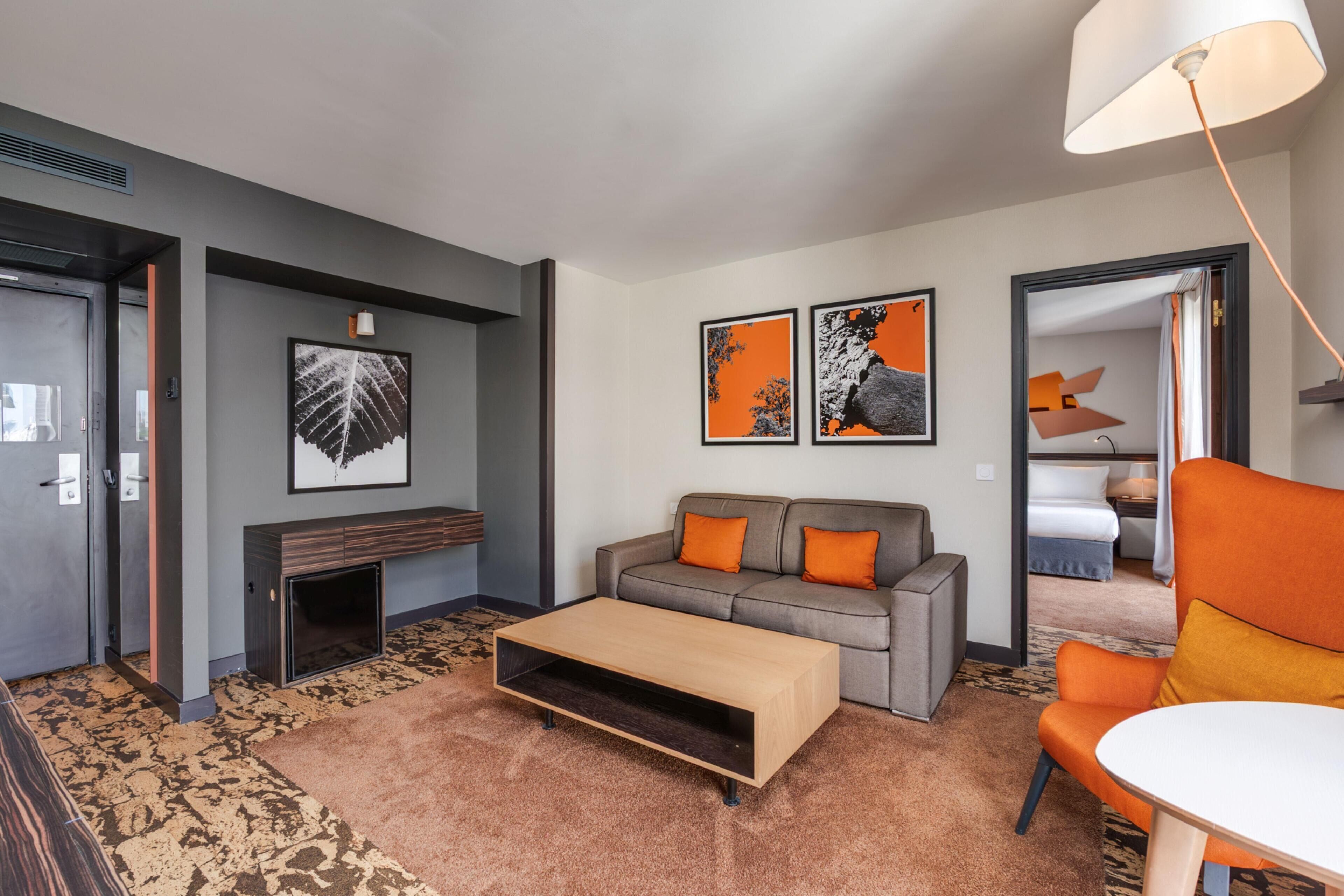 Suite, 1 Bedroom | Living area | 55-inch flat-screen TV with cable channels