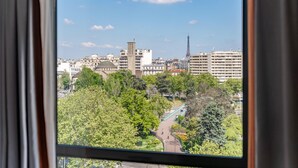 A cityscape with buildings, trees, and a clear sky.