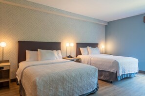 A hotel room with two beds, each with a headboard, bedside tables, and lamps. - Home2 Suites By Hilton North Attleboro (North Attleboro)