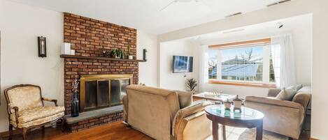 Smart TV, fireplace, books