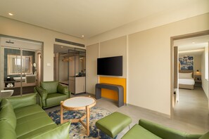 Suite, 1 Bedroom | Living area | 55-inch Smart TV with satellite channels, Netflix, streaming services - Hilton Garden Inn Goa Calangute (Calangute)
