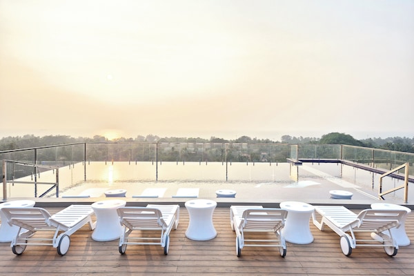 Outdoor pool, open 9:00 AM to 10:00 PM, pool umbrellas, sun loungers
