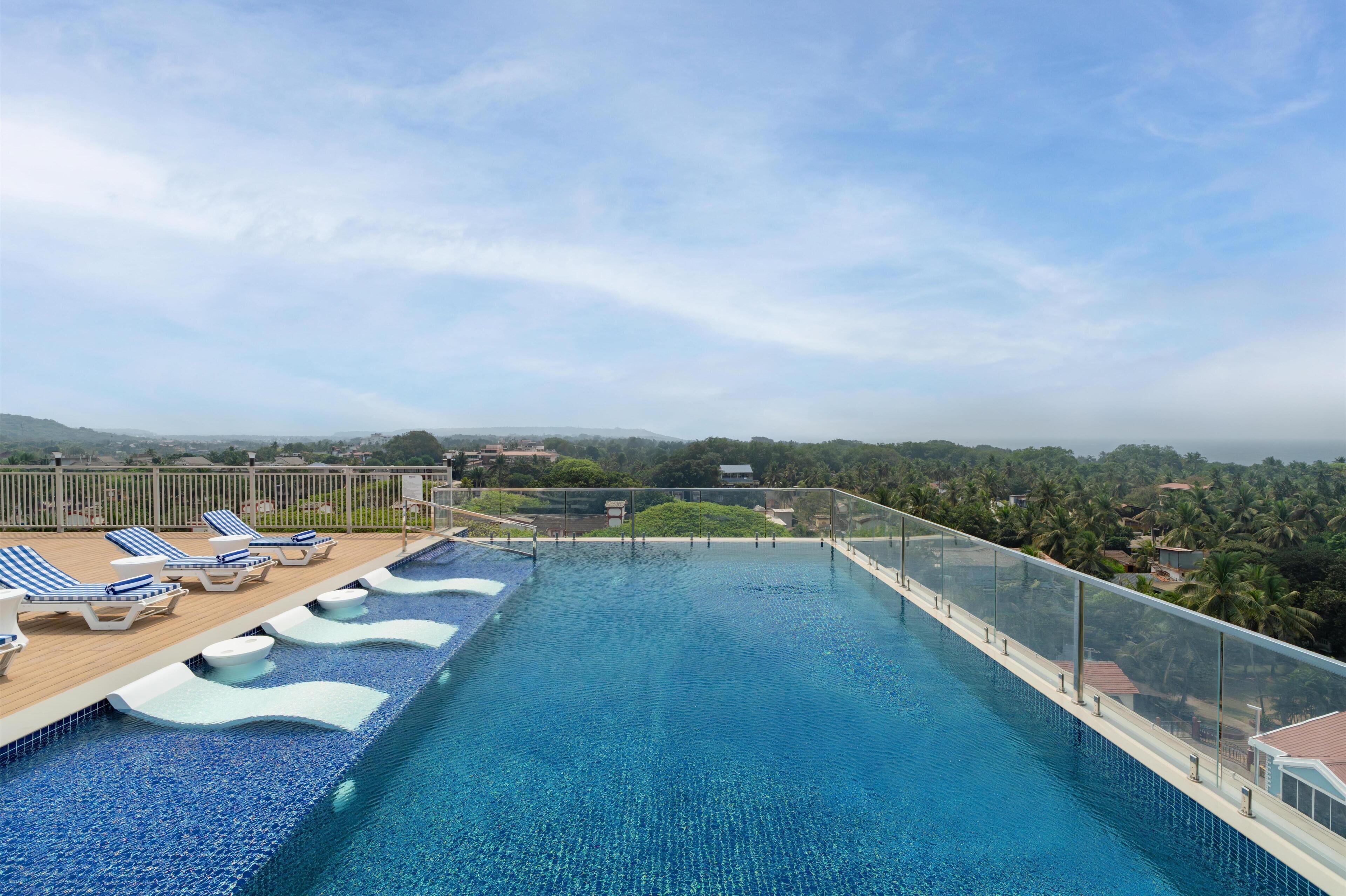 Outdoor pool, open 9:00 AM to 10:00 PM, pool umbrellas, pool loungers