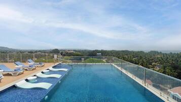 Outdoor pool, open 9:00 AM to 10:00 PM, pool umbrellas, pool loungers