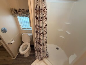 Shower, towels, soap, toilet paper