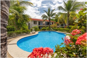 Outdoor pool - Beautiful condo! Steps to beach, shops, dining! (Coco)