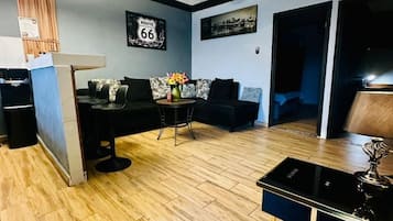 Deluxe Apartment, City View | Living area | Flat-screen TV