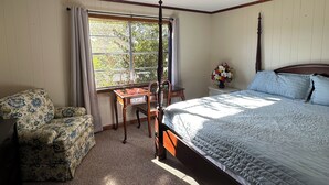 A bedroom with a bed, a desk, a chair, a ceiling fan, and a window with curtains. - Lake Life is Calling! Minutes to Cypress Bend Park, private 5-Acre Retreat (Florien)