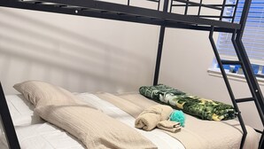 A bunk bed with white bedding and a green patterned blanket. - This house is renovates in and outNew furniture ready for enjoy plenty of space (Provo)