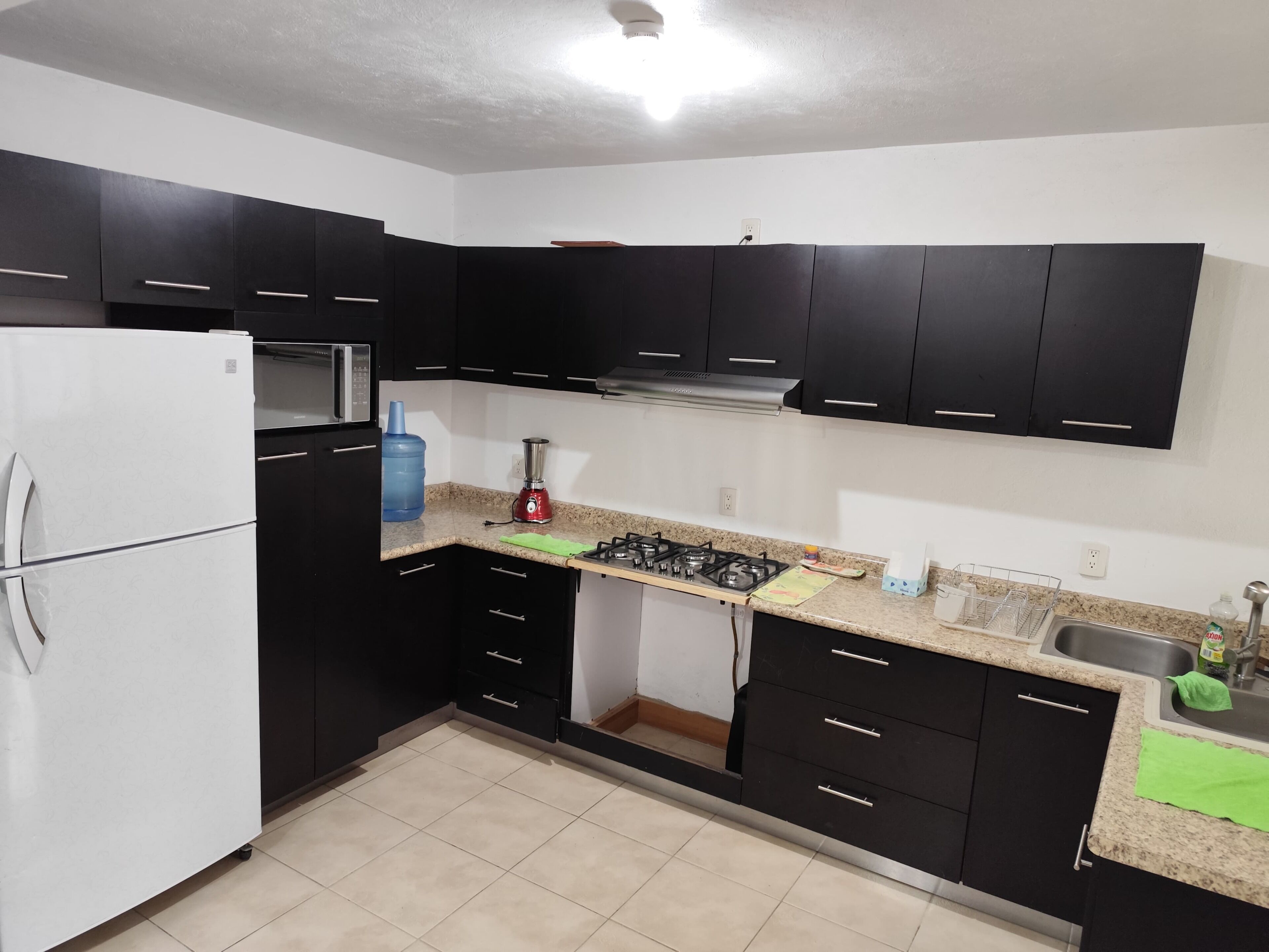 Fridge, microwave, cookware/dishes/utensils, dining tables