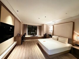 Four Seasons King Room | Desk, laptop workspace, blackout drapes, iron/ironing board