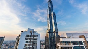 A high-rise building with a modern glass facade, surrounded by other contemporary buildings. - Saigon Stay at Vinhomes Central Park (Ho Chi Minh City)