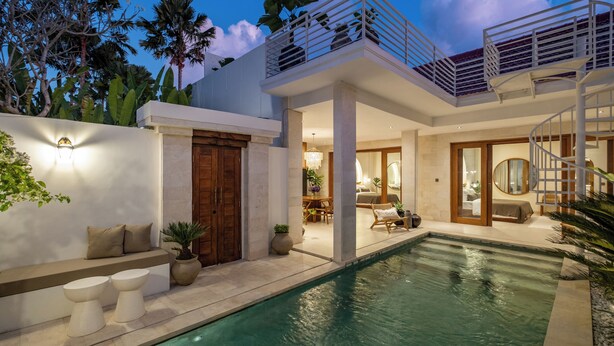 A modern house with a swimming pool, a balcony, and a staircase. - Modern Villa 2BR Casa Azuca by OriVista (Canggu)